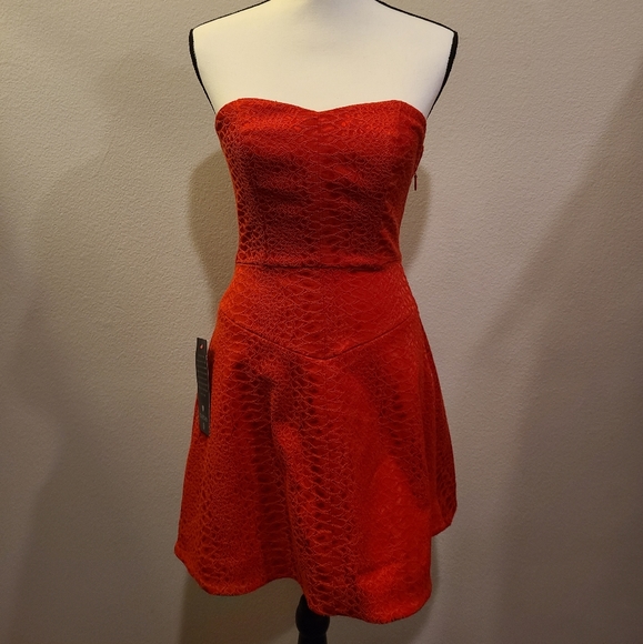 bebe Dresses & Skirts - Bebe Snakeskin Sweetheart Dress